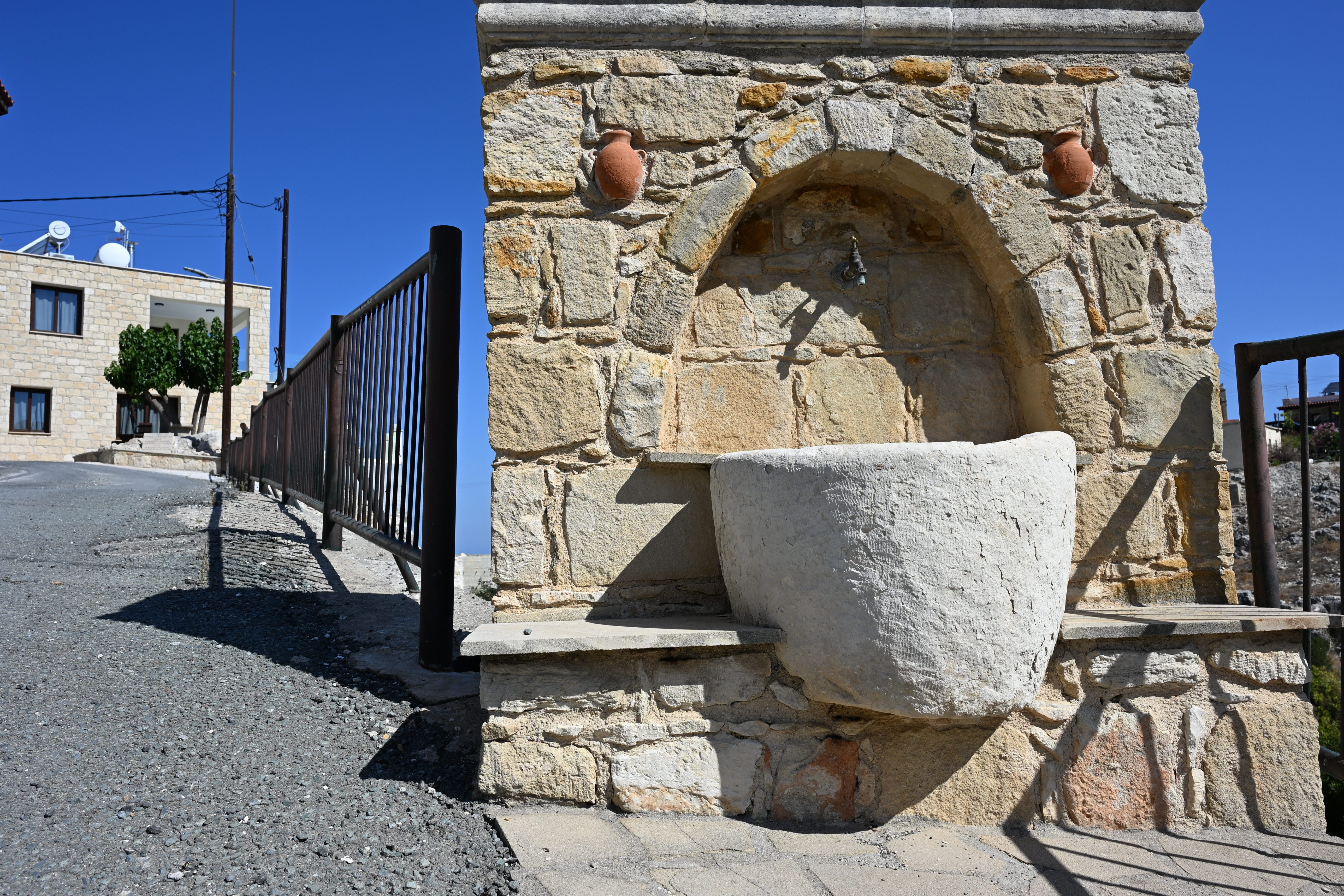 a stone water fountain near The Queen