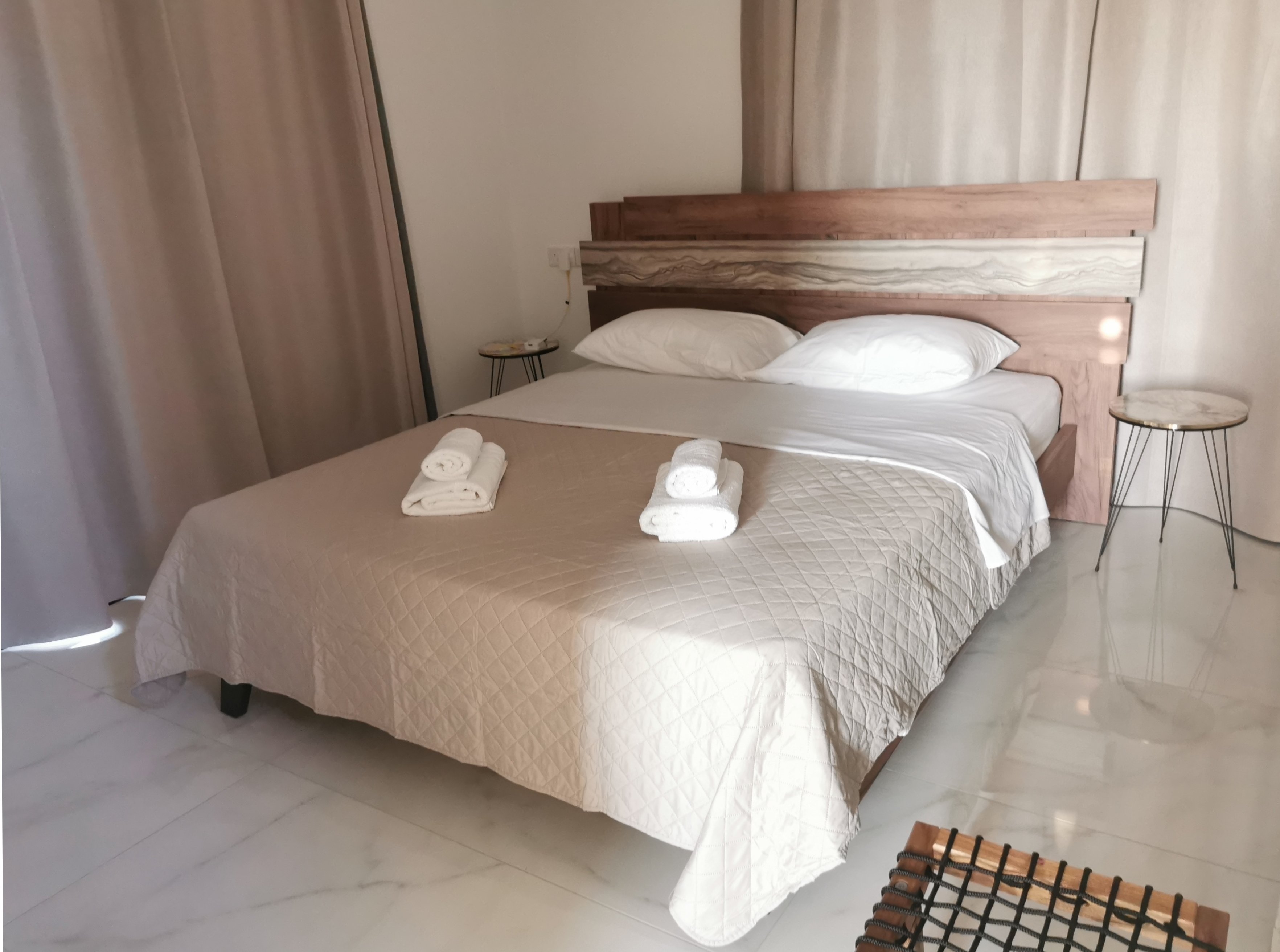 The Queen's double-bed with curtains