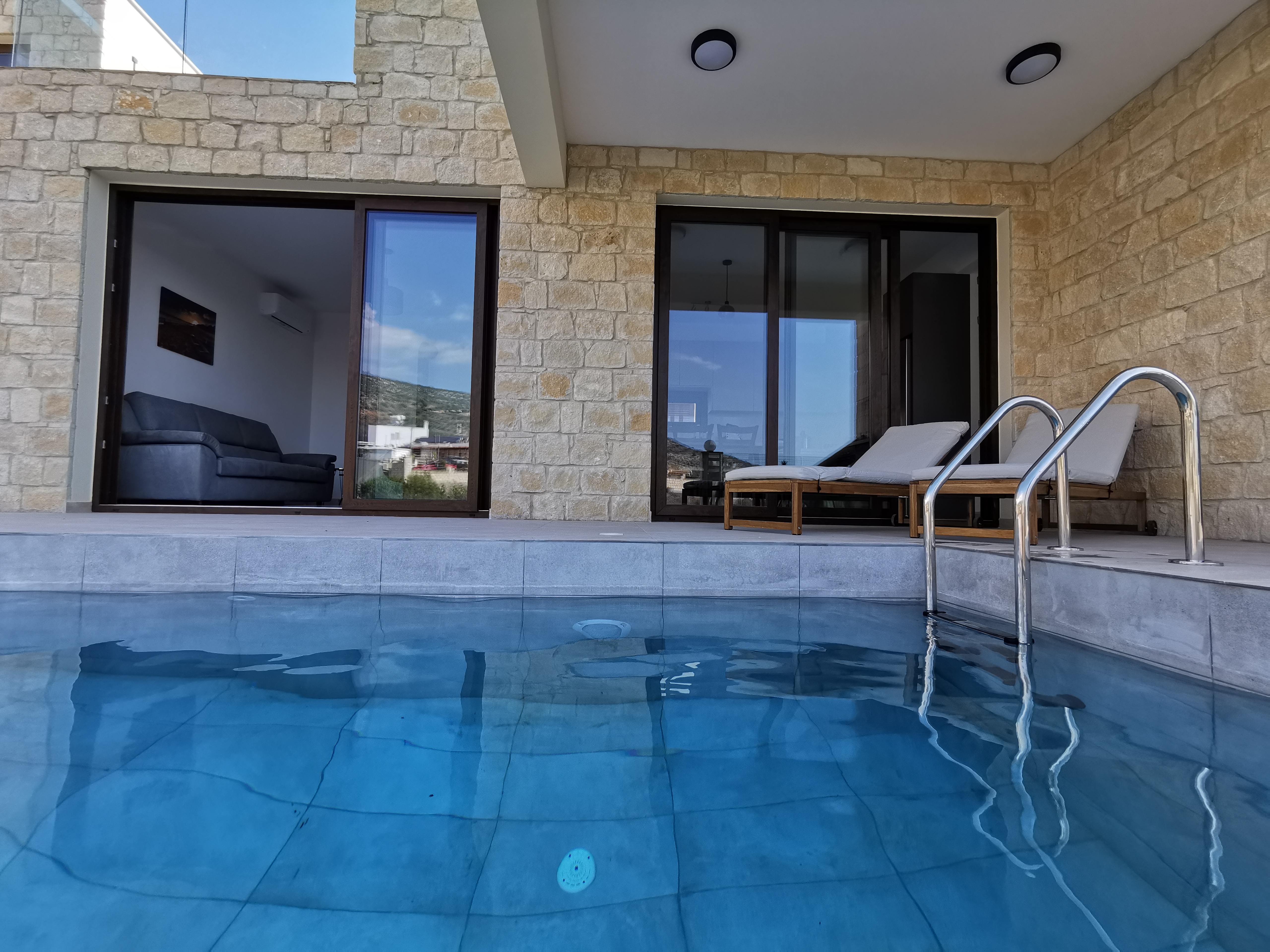 A close-up of The Prince's pool with the sunbeds